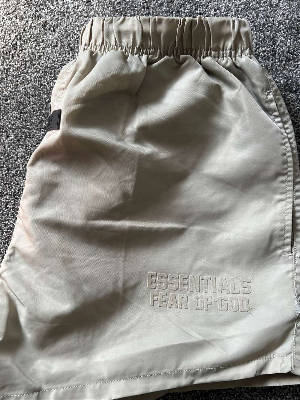 ESSENTIALS Men’s Cream Track Pants with Black Logo Patch